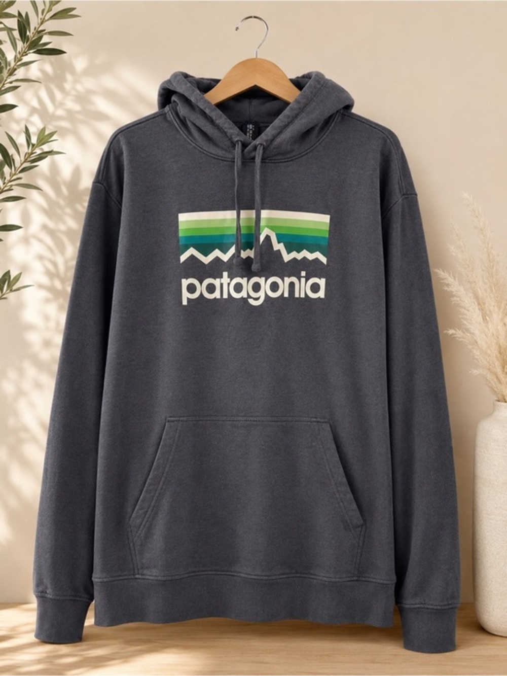 Patagonia Dark Gray Hoodie with Green Stripe Logo